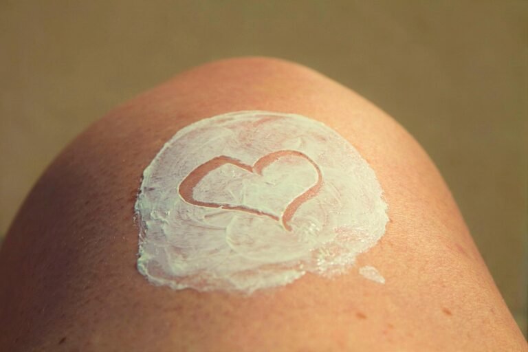 Woman applying moisturiser for dry skin in winter