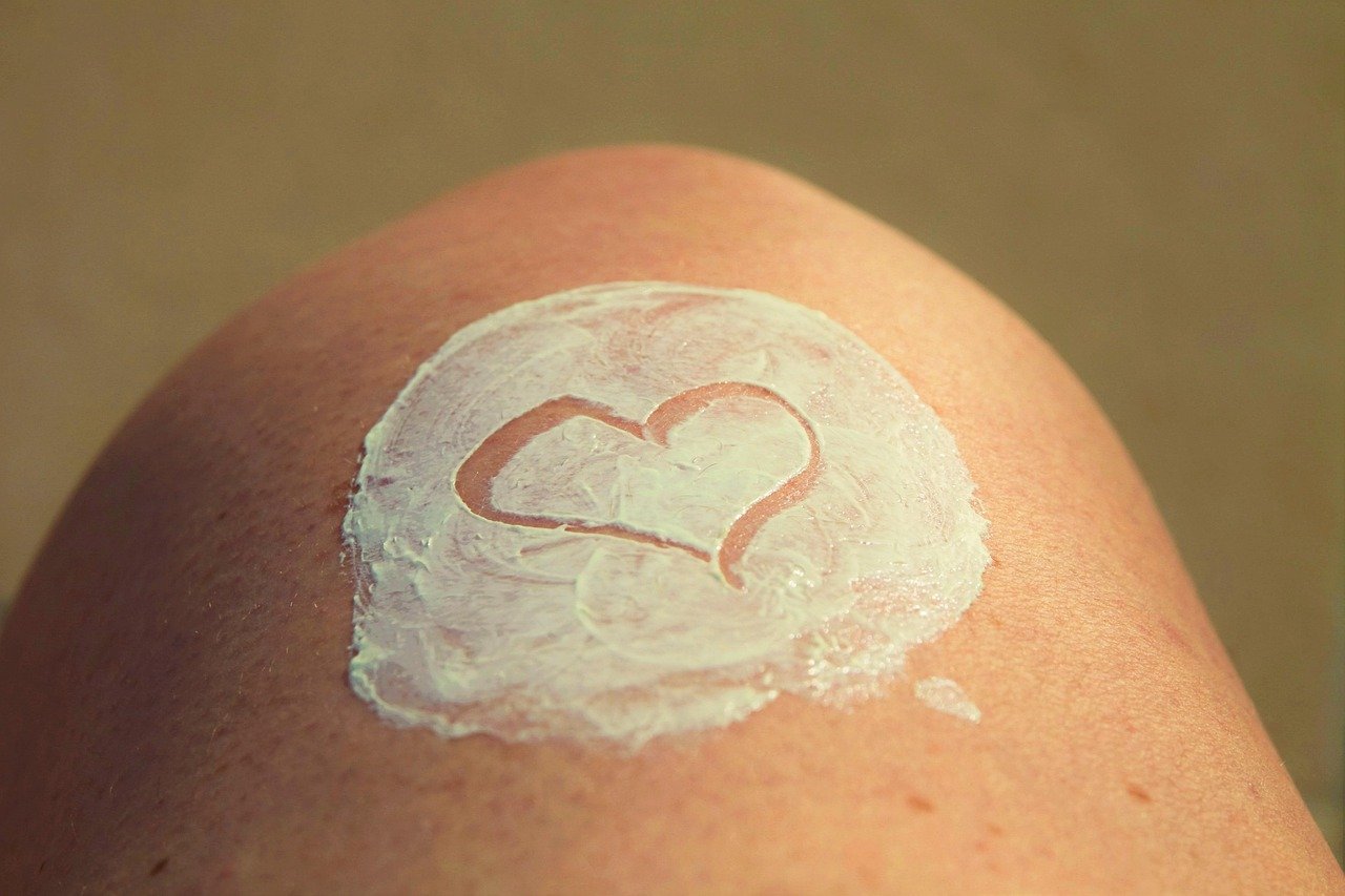 Woman applying moisturiser for dry skin in winter